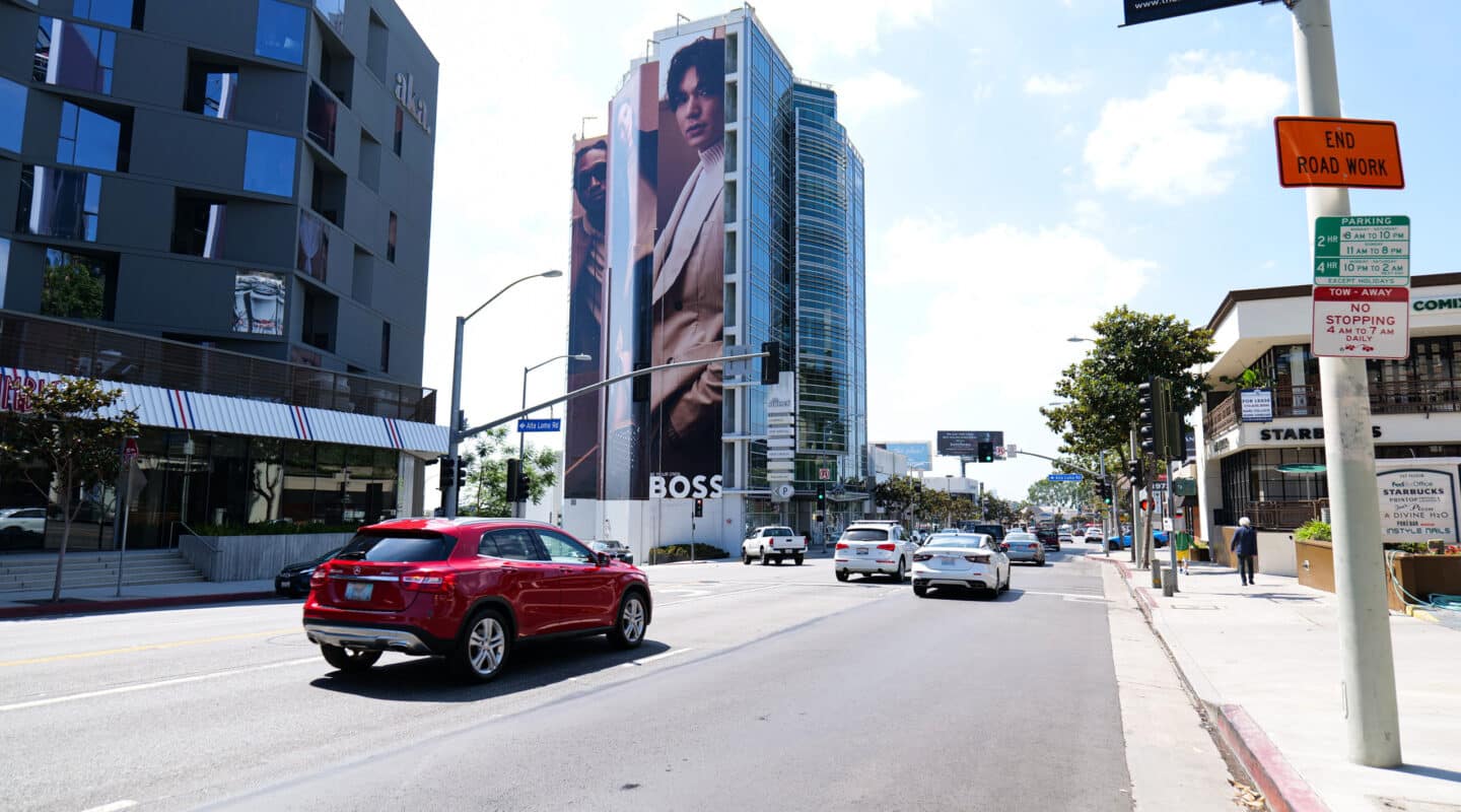 Clear Channel Outdoor wallscape shown on a busy roadway