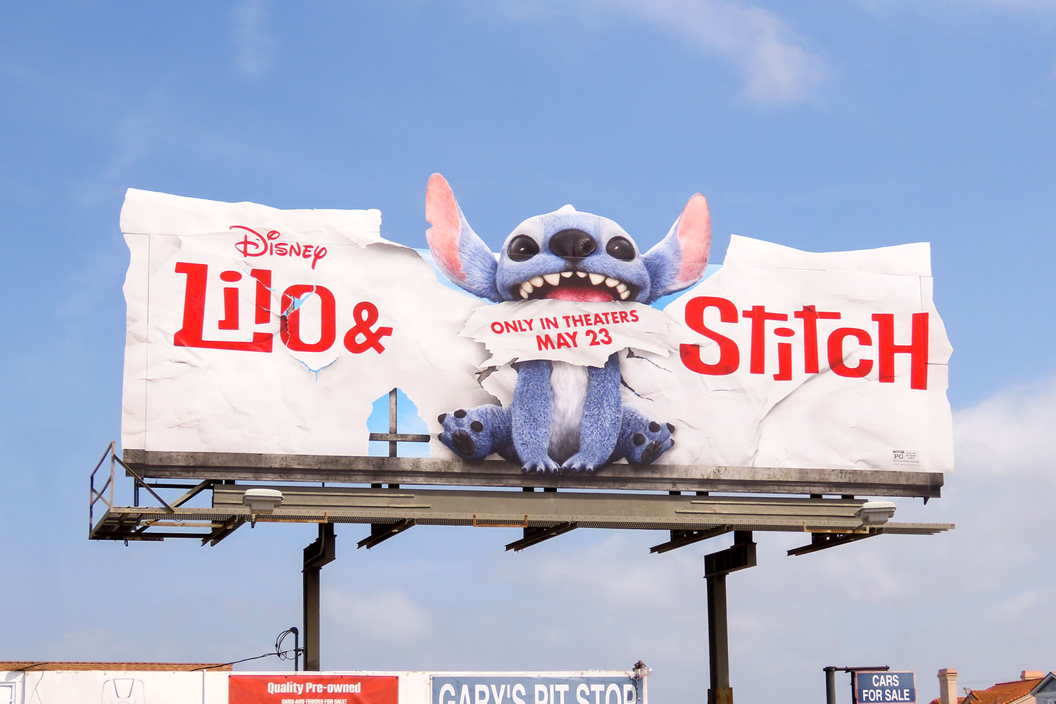 ed breaking the plane Lilo and Stitch billboard for Walt Disney Studios Motion Pictures